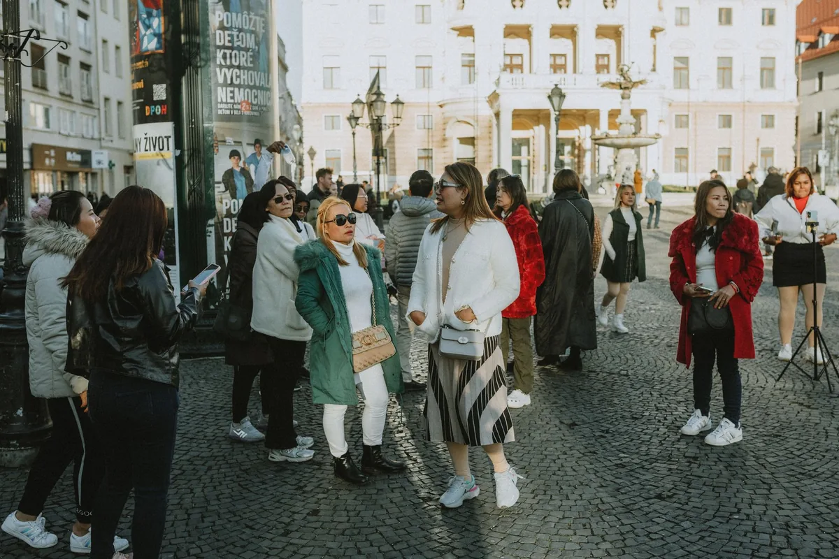 tourist group walking city street