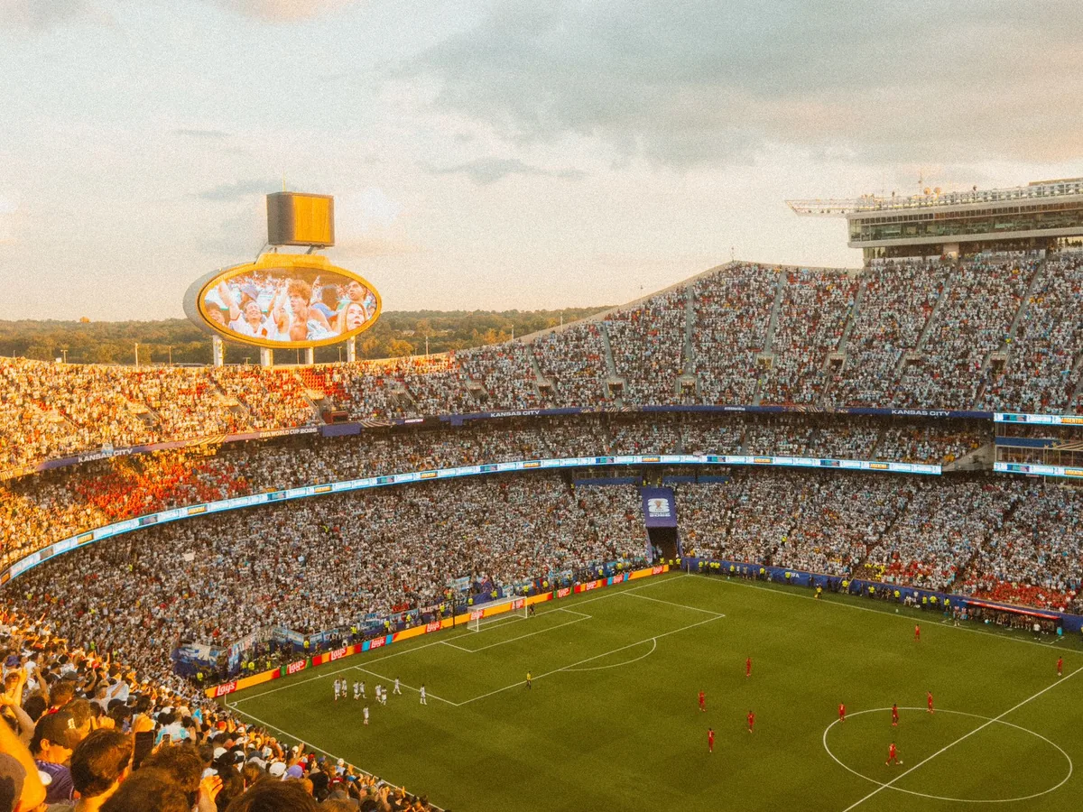 football stadium exterior with evening crowds