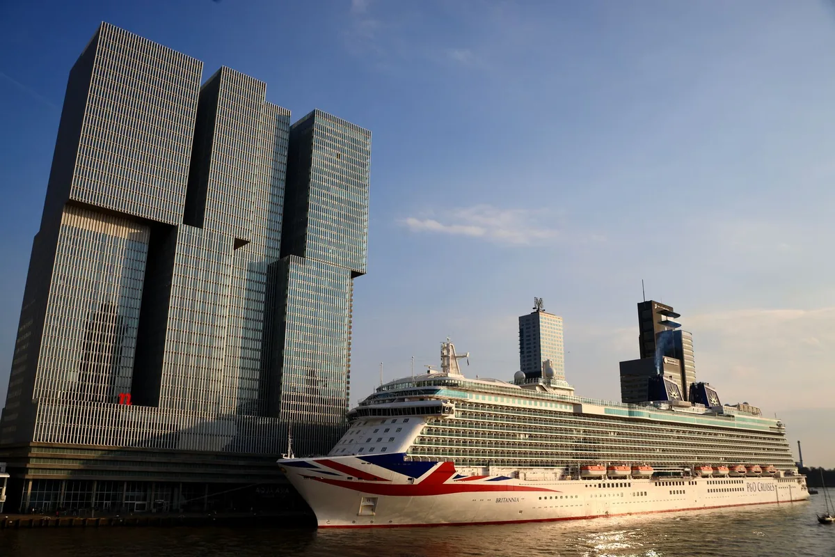 cruise ship docked at a European port city