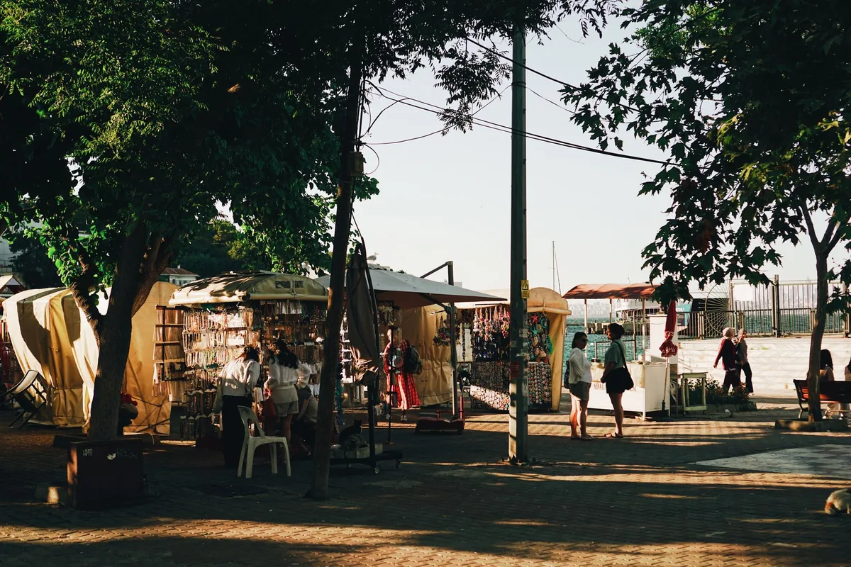 local street market with vendors and tourists interacting
