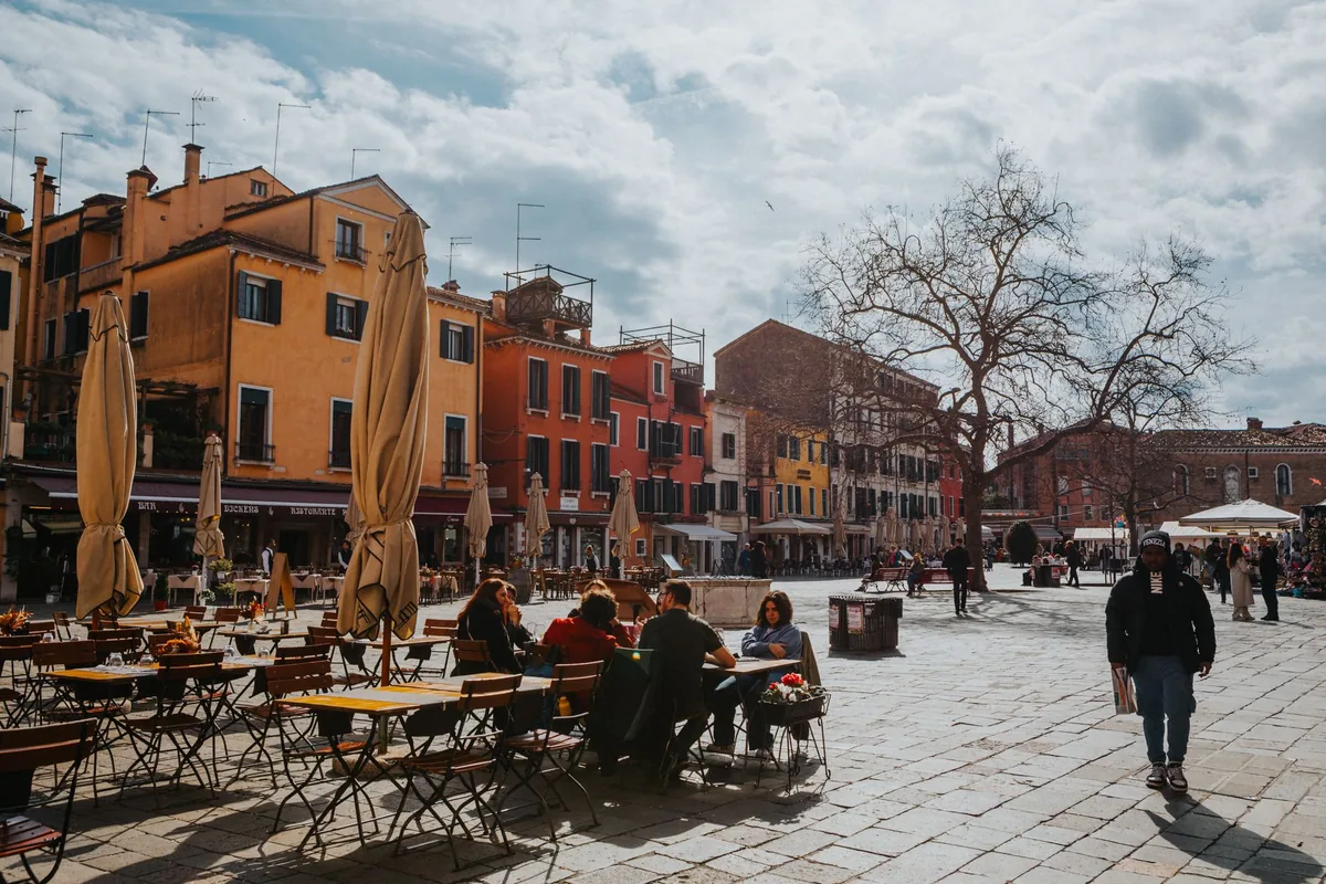 outdoor dining plaza with pedestrians